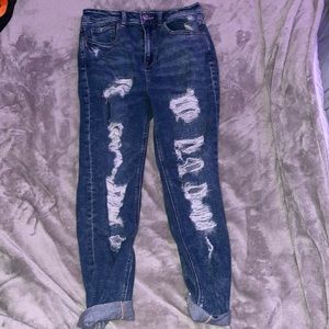 Women’s ripped blue American eagle jeans.